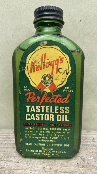 old green glass bottle of castor oil