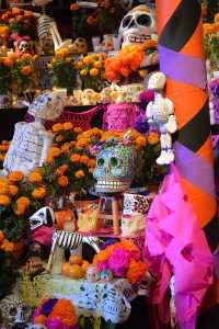 showing an ofrenda or altar to remember a departed one on day of the dead Dia de muertos