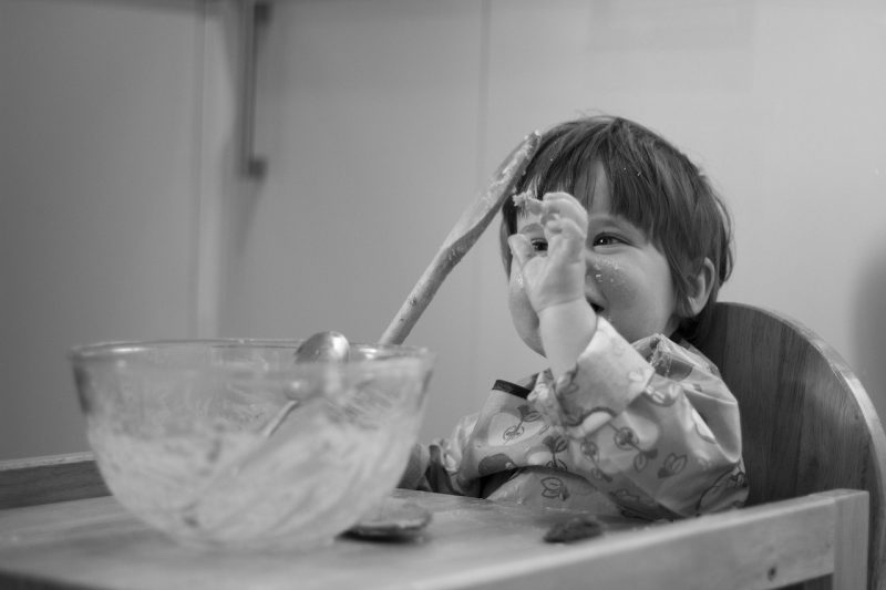 baby helping make a cake