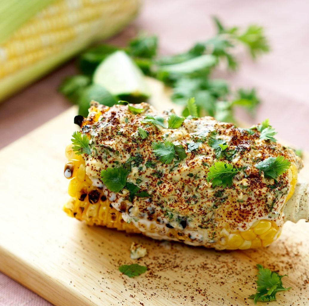 savor-the-southwest-corn-roasted-mexican topped with crema and cilantro