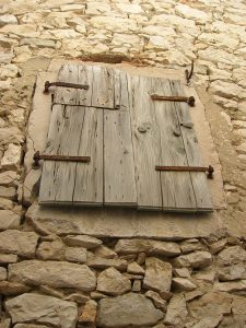 Croatian window shuttered for the night on savor the southwest to go with the memory being related