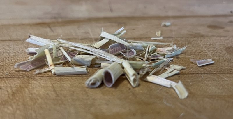 diced culms of lemongrass on a cutting board