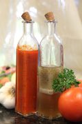 two types of dressings in glass bottles