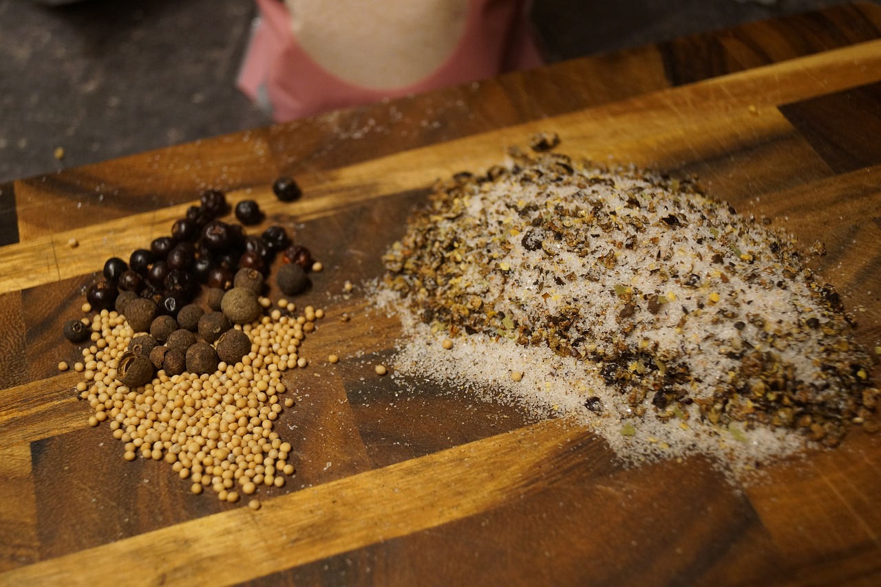 cutting board with a variety of herbs and spices to use to make the herbal blends discussed on savor the southwest