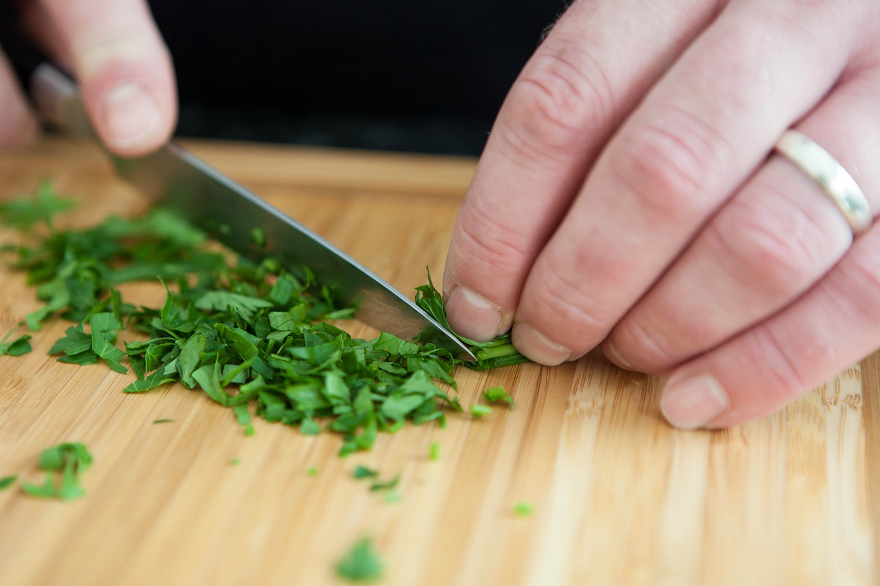 hand chopping fresh parsley