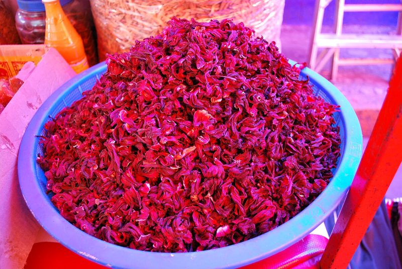 dried hibiscus flowerrs for sale in a mexico market image copyright T Dayter