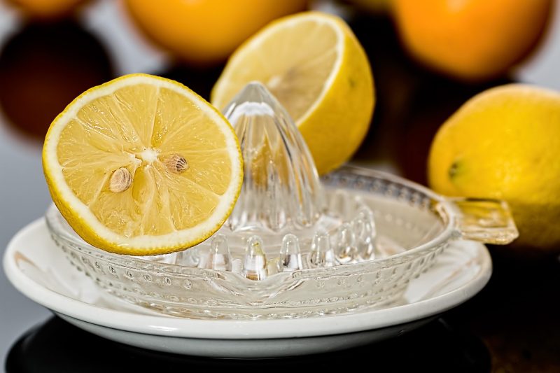 glass juicer and cut lemons to juice