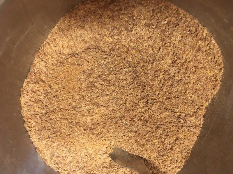brown granular mesquite meal from ground mesquite pods with the seeds inside