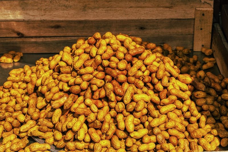 peanuts rolled in ground golden colored marigold petals to make them more yellow and thus more desirable and considered lucky to bring gold for the new year
