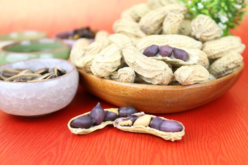 peanuts with tan shells but black inner husks instead of reddish