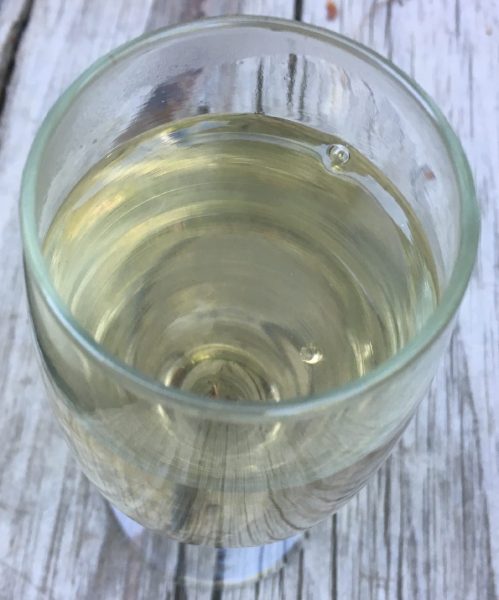 herbal tea made with rose petals is a pale straw color